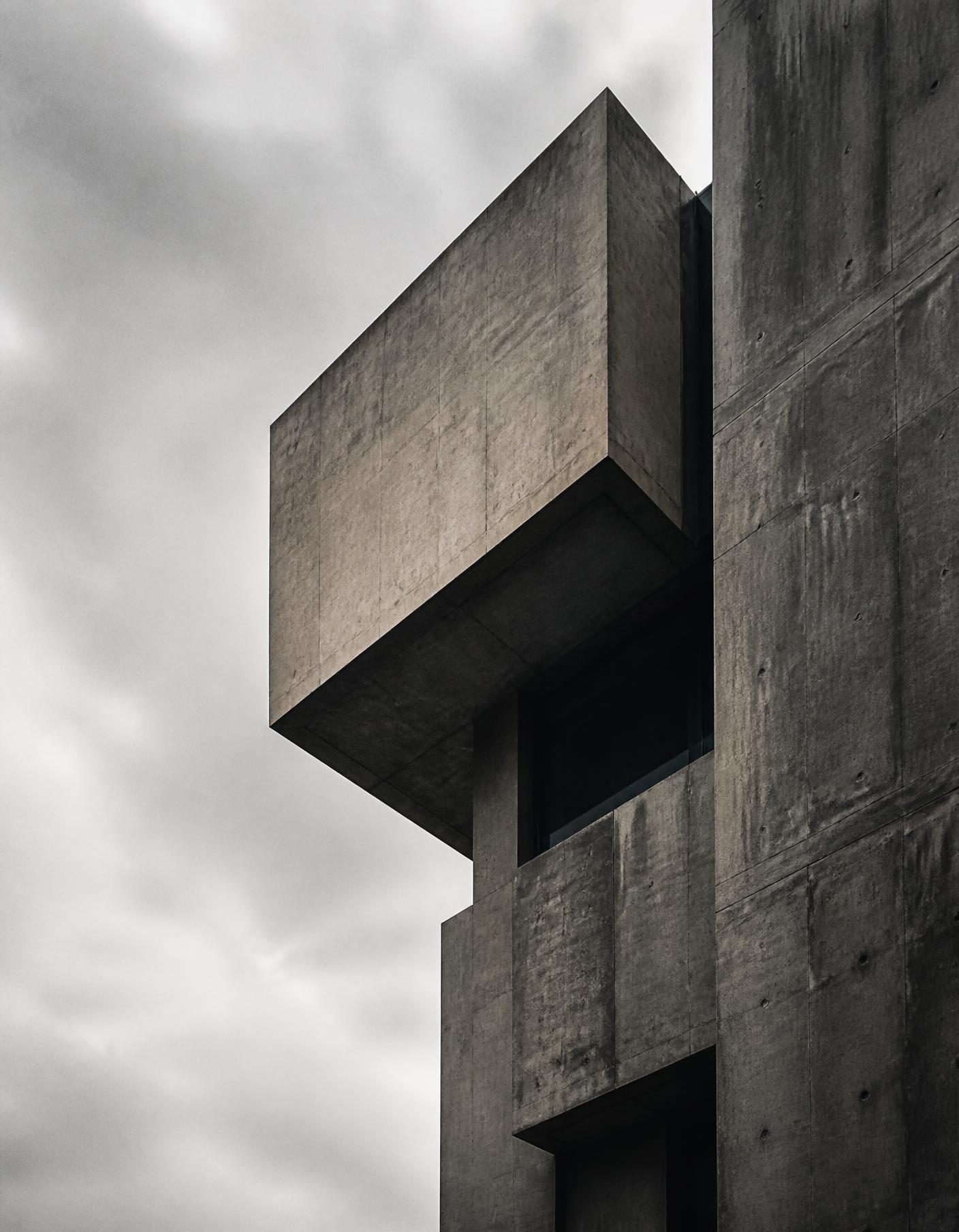 Brutalist concrete architecture against an overcast sky